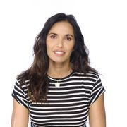 padma lakshmi stands against a white background