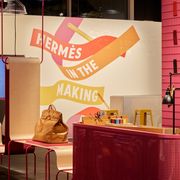 a photo of the heremes detroit exhibit hermès in the making including a used birkin bag and swatches of leather in detroit 2022